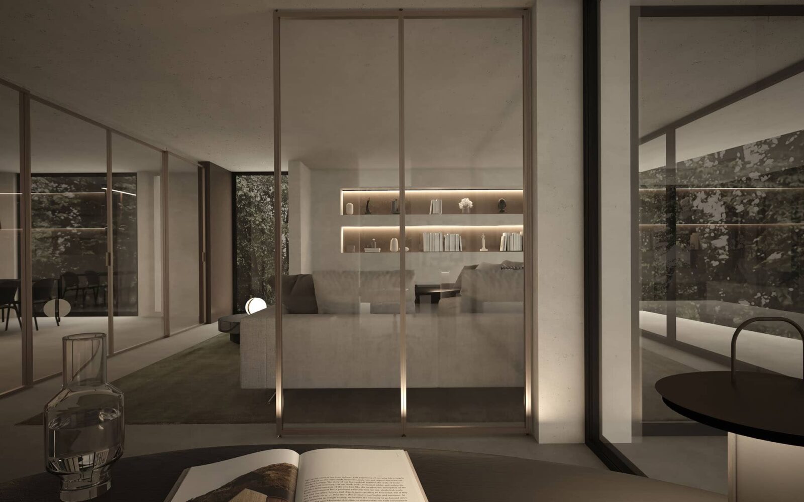 Altea Infinity partition wall with champagne finish edging and bronze stopsol glass. This glass is defined as transparent-reflective. This partition wall is located inside a modern living room at night.